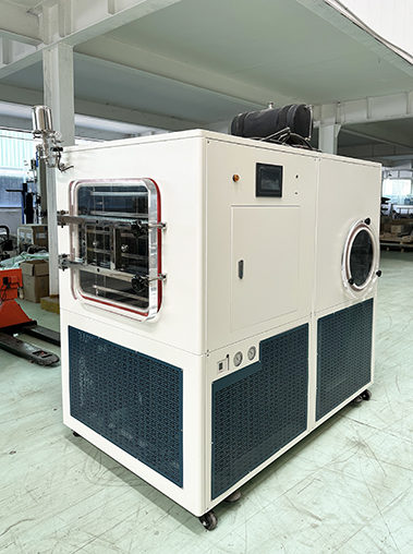 Right perspective real shot of a commercial laboratory freeze dryer in a workshop, featuring a touch control panel and circular viewing window.